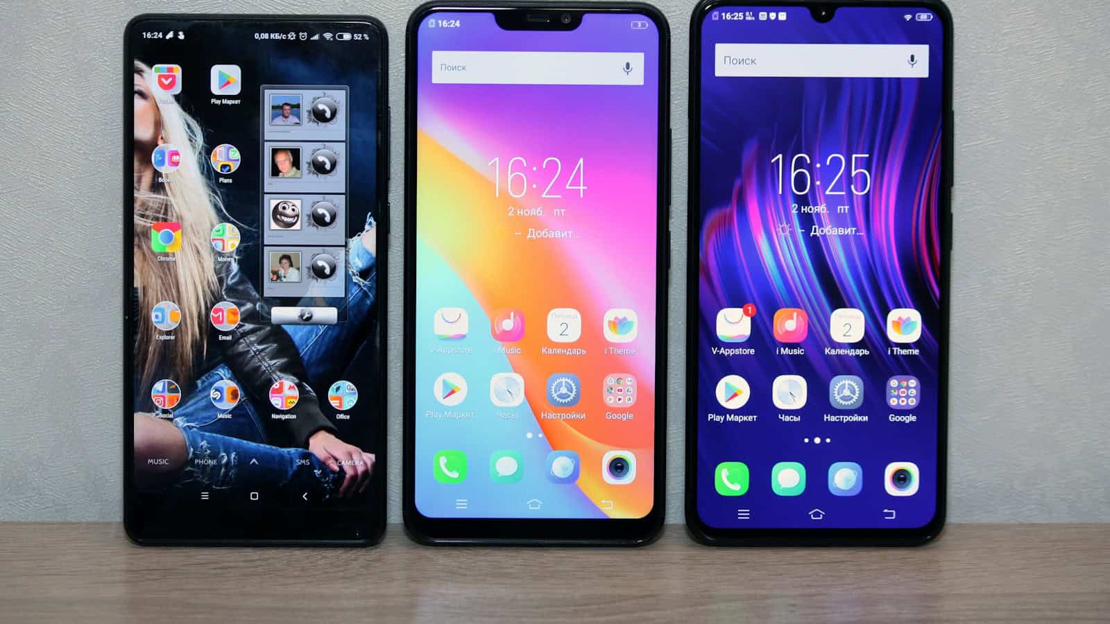 Three Android phones standing side by side, each showing a different home screen.