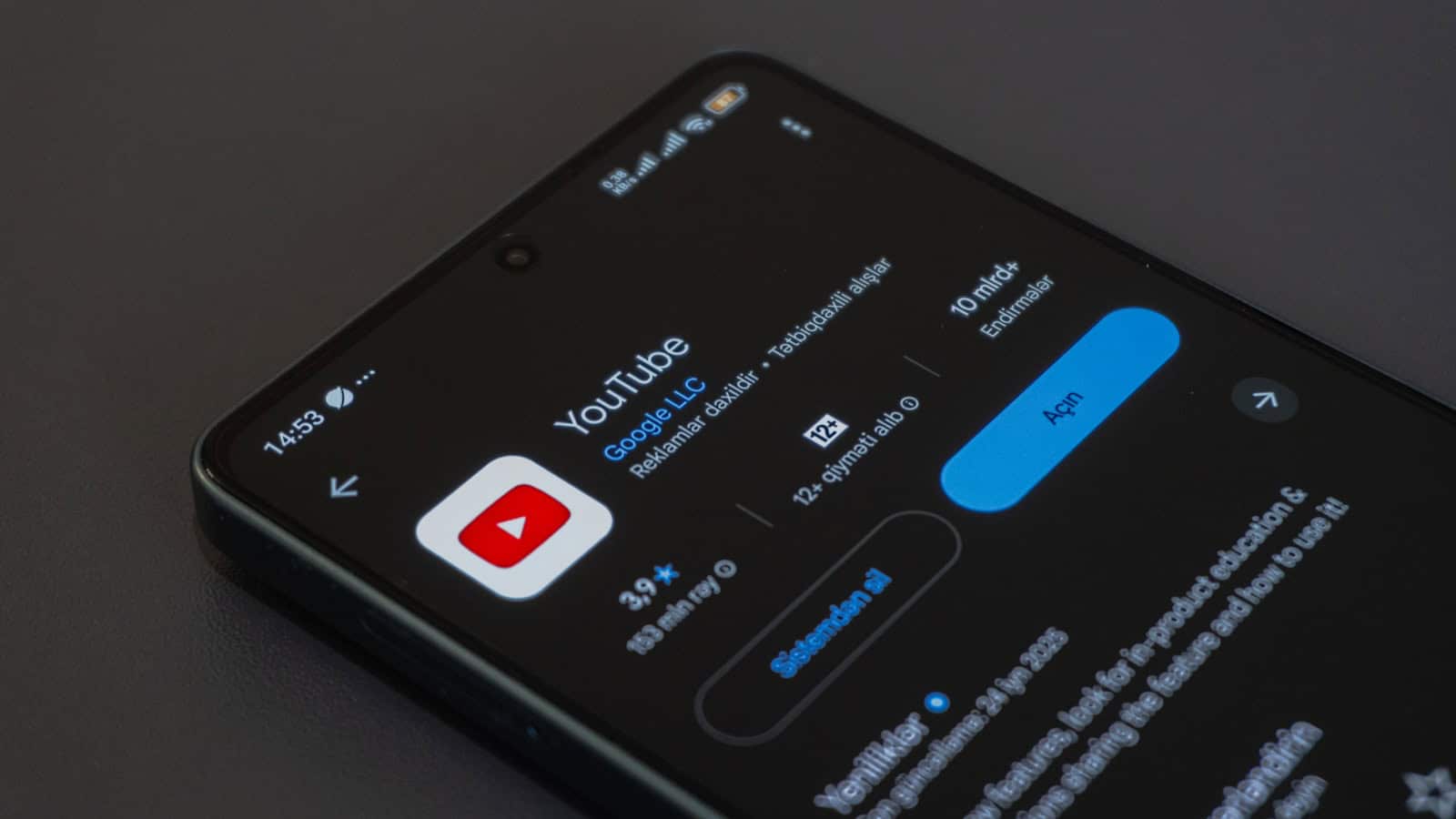 A close-up of the Google Play Store listing for the YouTube app on an Android phone.
